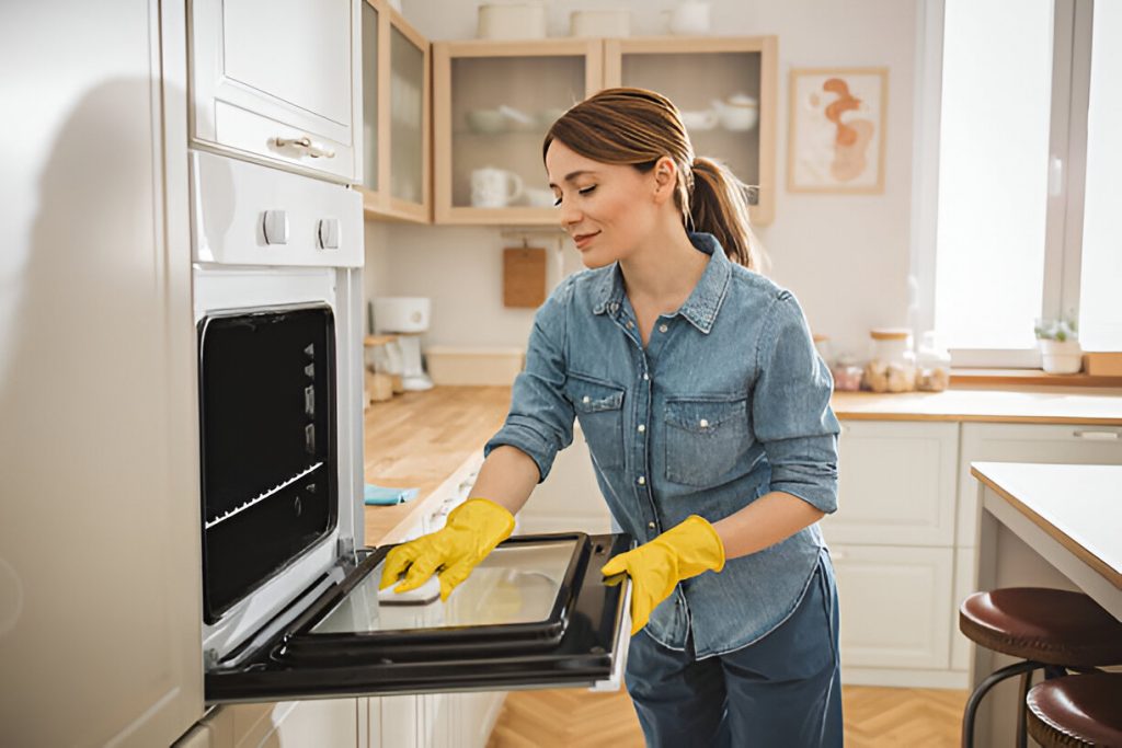Kitchen Cleaning woman in a modern kitchen using After detergents